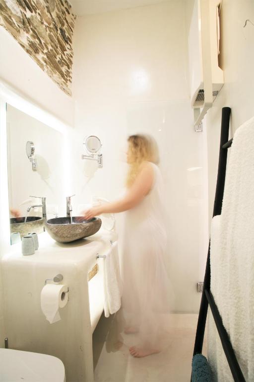 A bathroom at Lasia Boutique Apartment