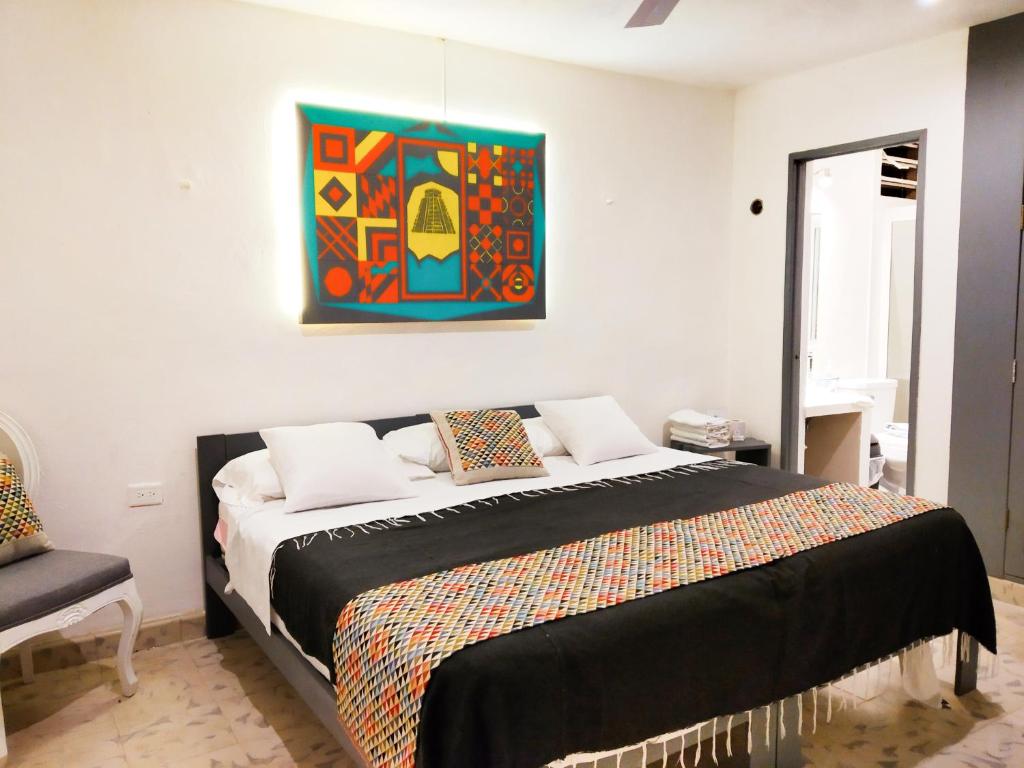 Postel nebo postele na pokoji v ubytování Hotel Downtown Merida