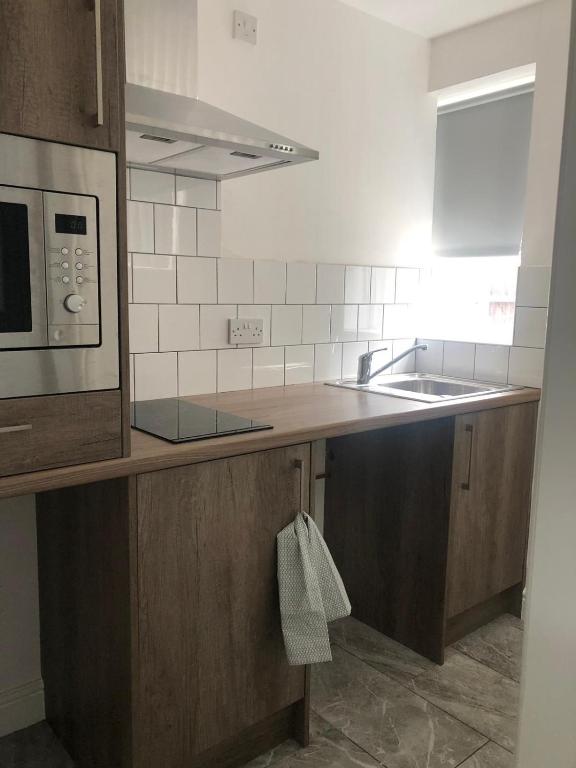 Kuchyň nebo kuchyňský kout v ubytování Lancaster Place Apartments