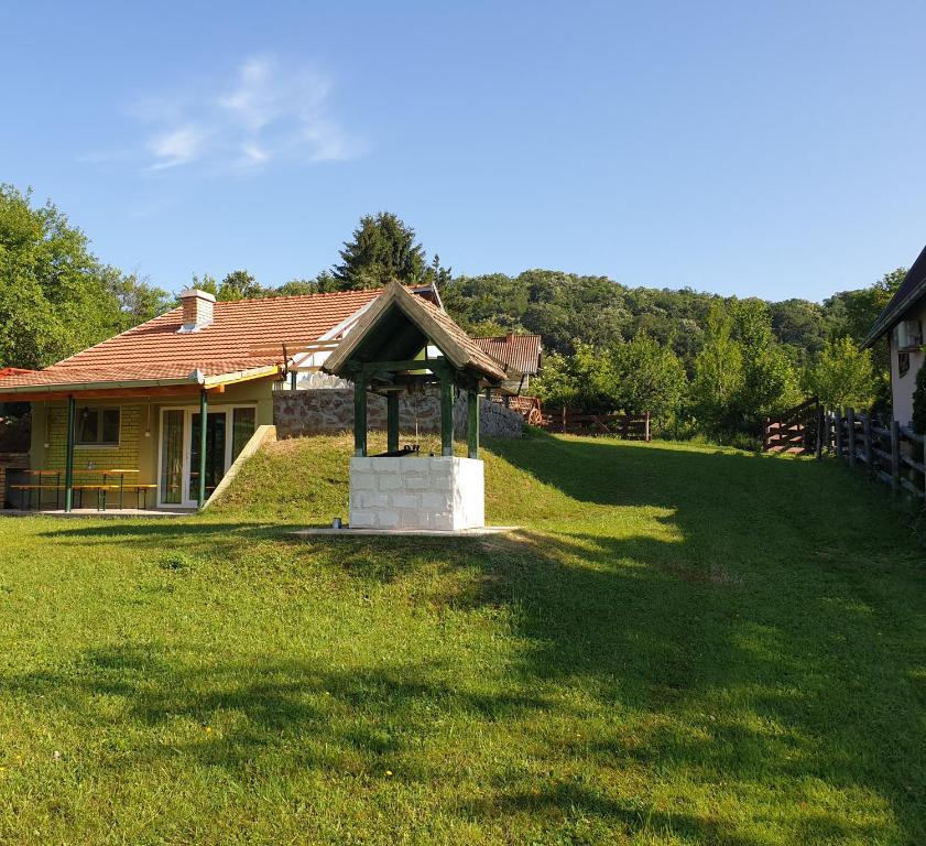 a house with a gazebo in the yard at Kula House Vrdnik in Vrdnik