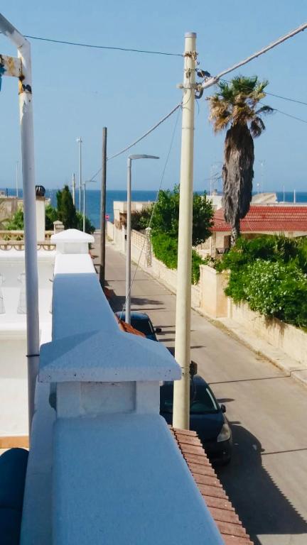 a view of the ocean from the balcony of a house at Relax House in Bari