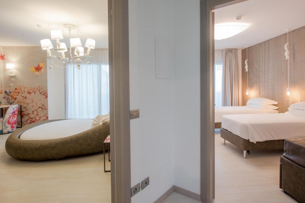 Кровать или кровати в номере Bibione Palace Hotel