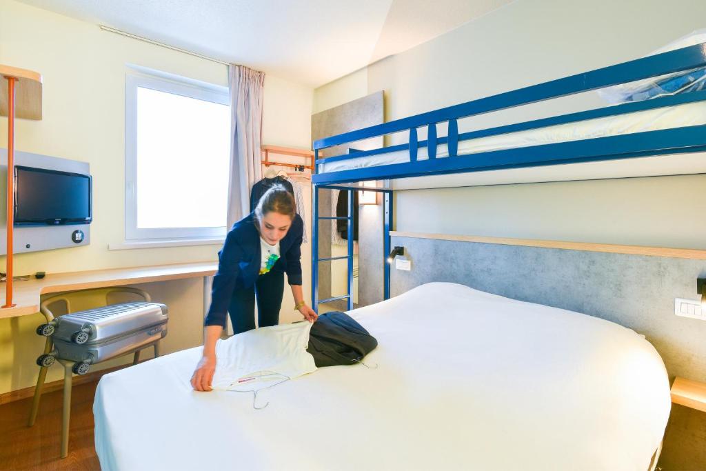 Postel nebo postele na pokoji v ubytování ibis Budget Charleroi Airport