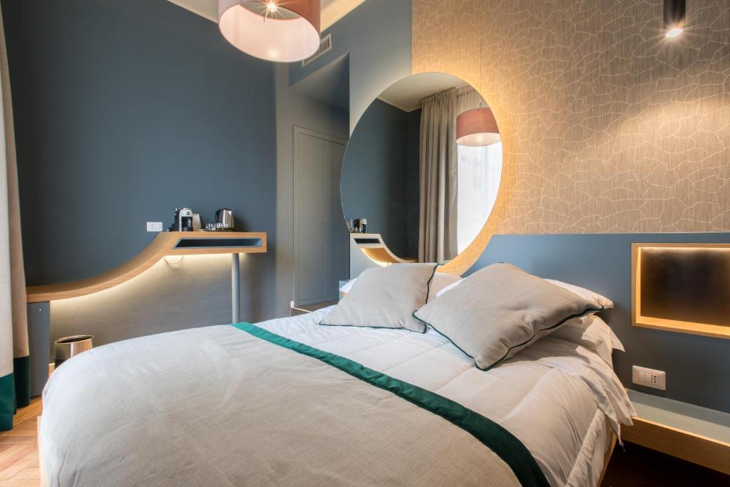 Кровать или кровати в номере Le Texture Premium Rooms Duomo-Cordusio