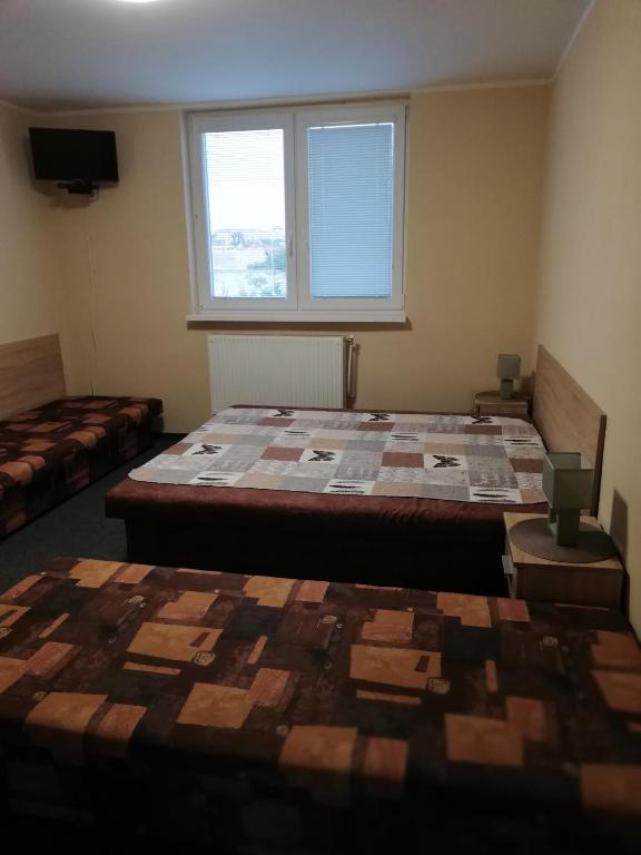 Postel nebo postele na pokoji v ubytování CENTRO