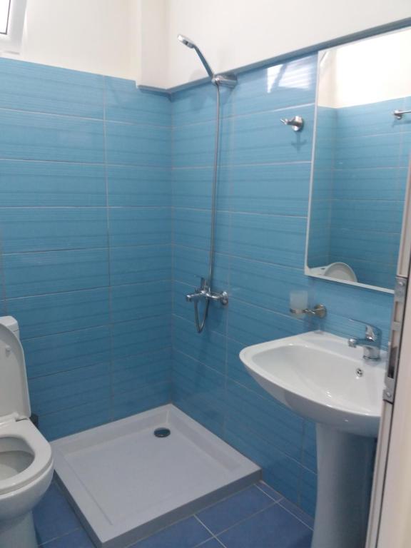 Koupelna v ubytování Qeparo Antonio Rooms