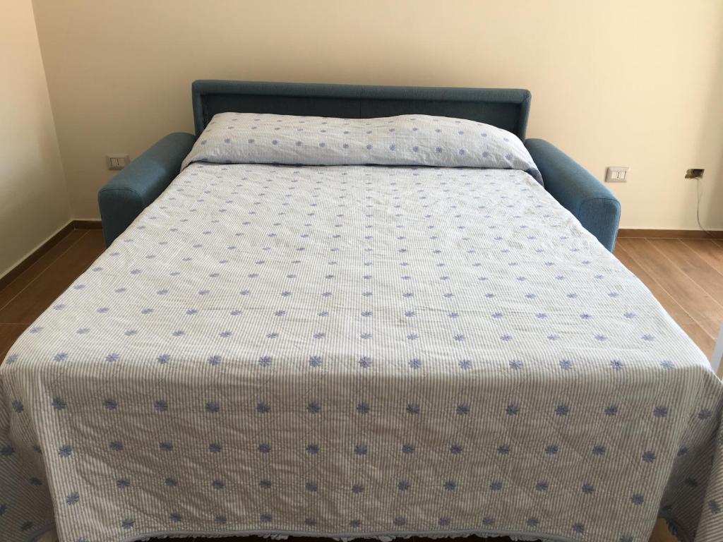 Łóżko lub łóżka w pokoju w obiekcie A Casa di Clara
