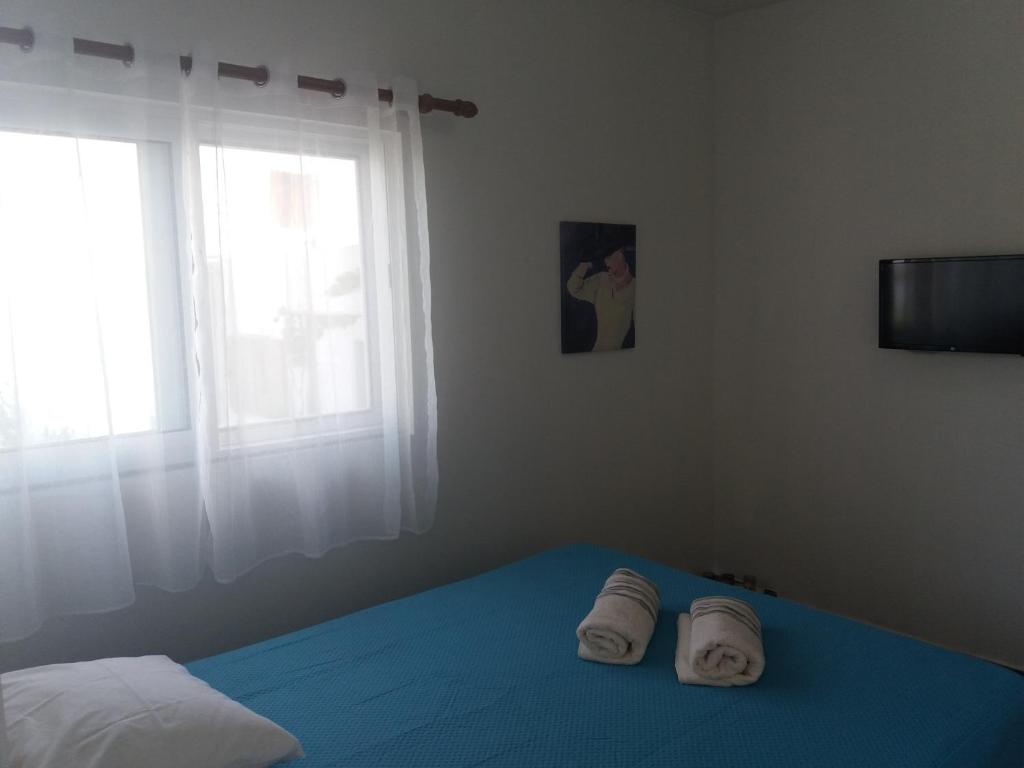Postel nebo postele na pokoji v ubytování Qeparo Antonio Rooms