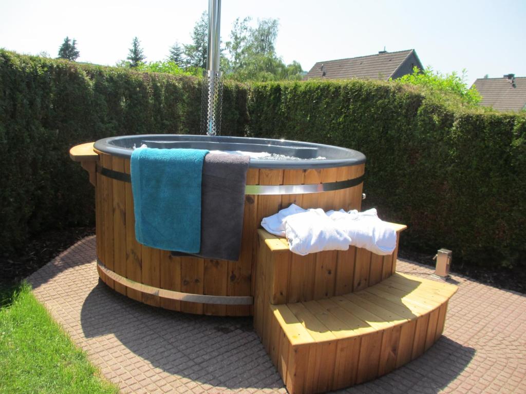 a hot tub with a towel on top of it at "Fewo am Siegsteig" in Dattenfeld