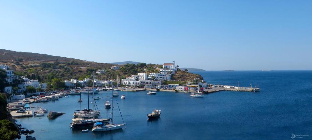 a group of boats are docked in a harbor at Lykomides in Skiros