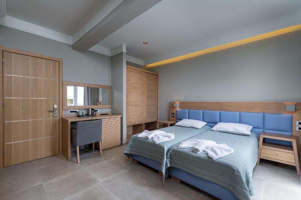 Postel nebo postele na pokoji v ubytování Argiri Resort Hotel & Apartments