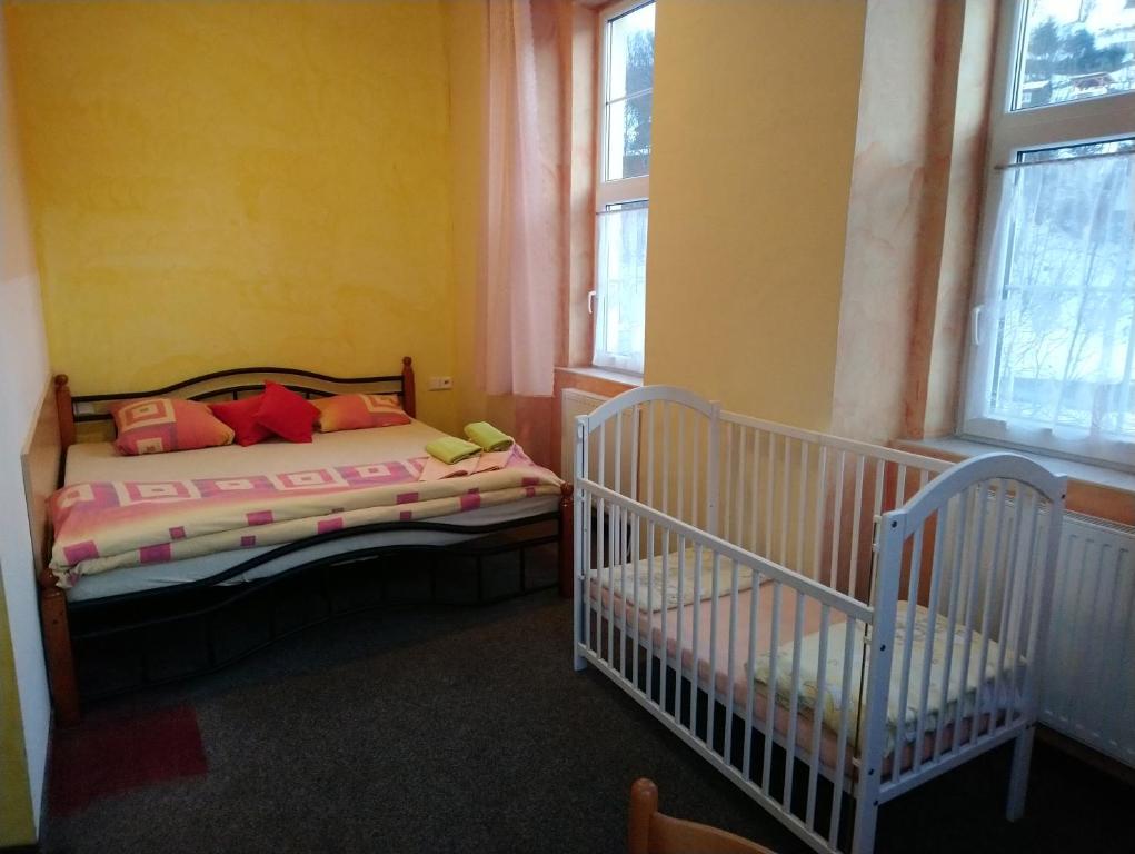 Postel nebo postele na pokoji v ubytování Penzion Volyňka