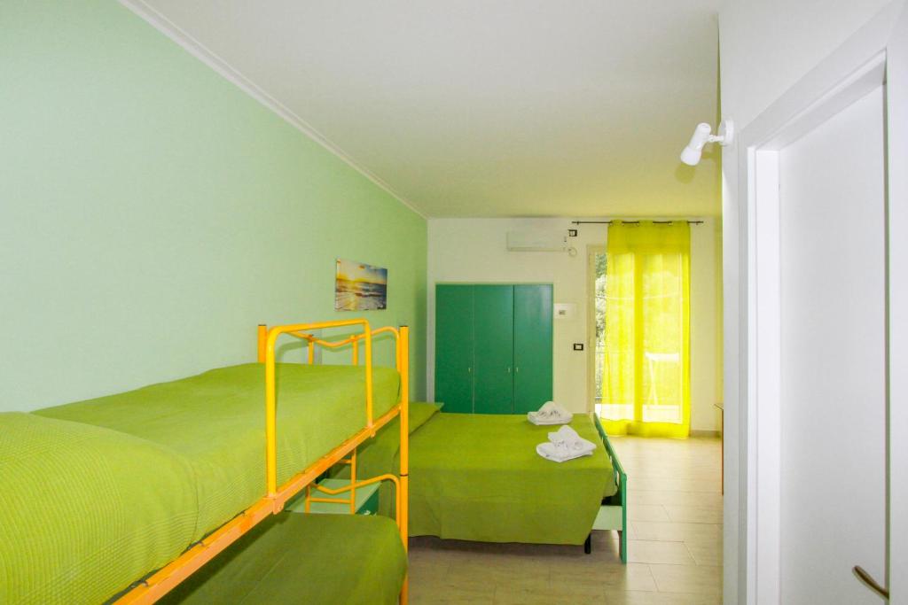 En eller flere senge i et værelse på Residence Calavà