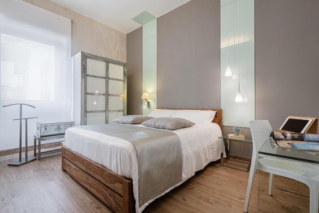 Postel nebo postele na pokoji v ubytování 231 Suite Via Roma