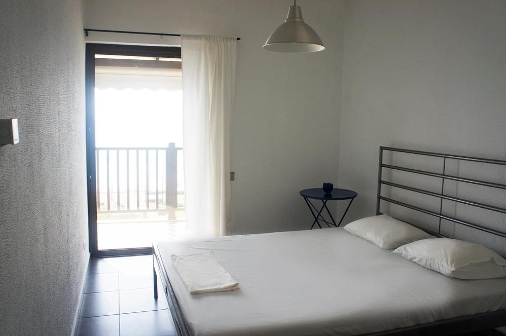 Postel nebo postele na pokoji v ubytování Possidi Aigaiopelagitika 2-floor beach house