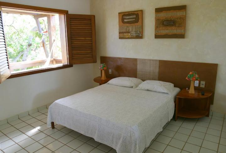 Cama ou camas em um quarto em Pousada Girassol