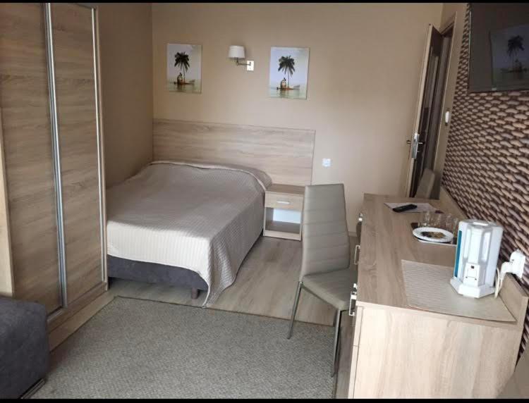 Giường trong phòng chung tại Pokoje i apartamenty "Iza"
