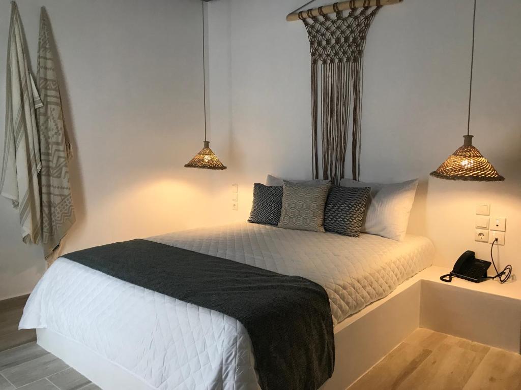 Postel nebo postele na pokoji v ubytování AELLIA HOTEL & SUITES LEROS