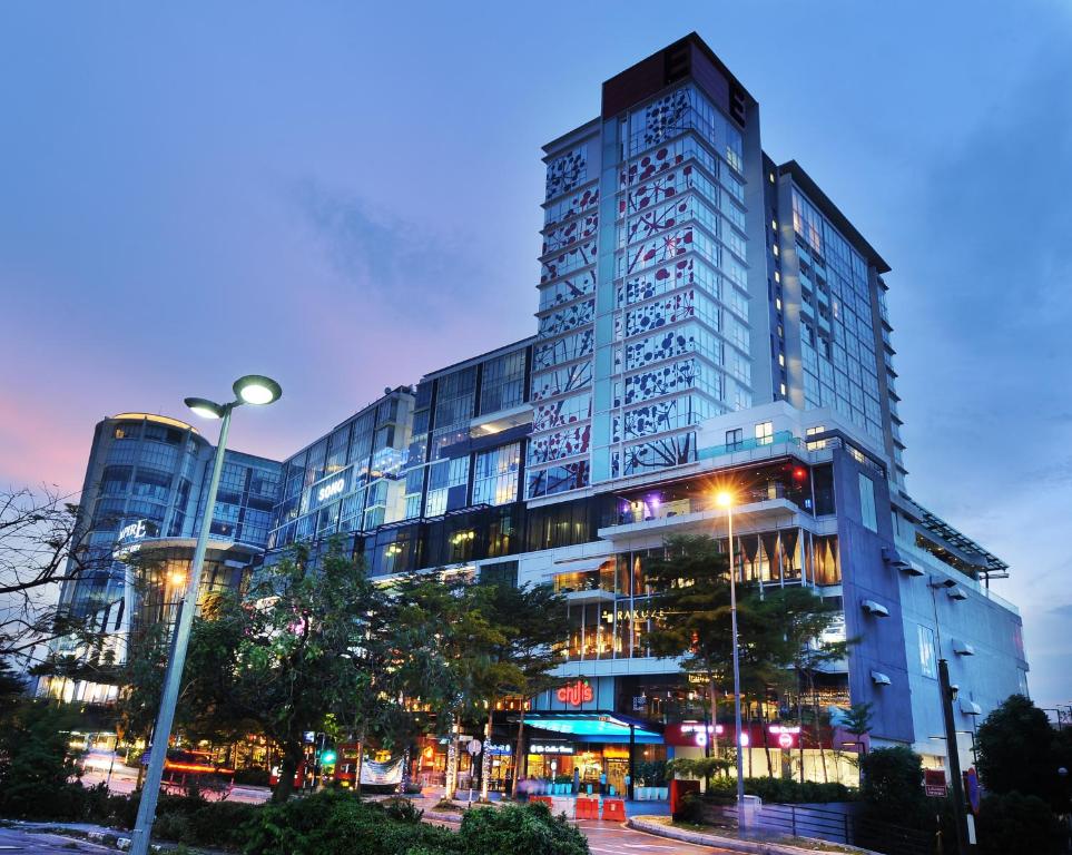 a tall building with lights in front of it at Empire Hotel Subang in Subang Jaya