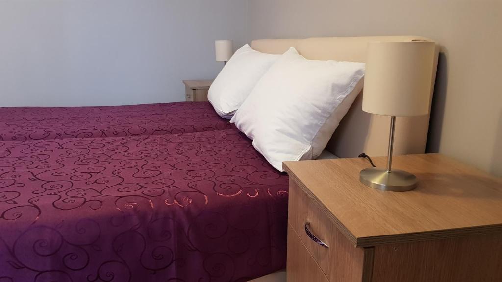 Postel nebo postele na pokoji v ubytování Apartments Tatjana