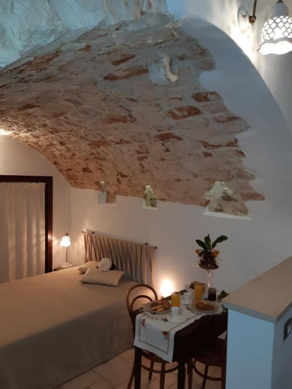 Postel nebo postele na pokoji v ubytování Donna Lucrezia dimora a corte B&B