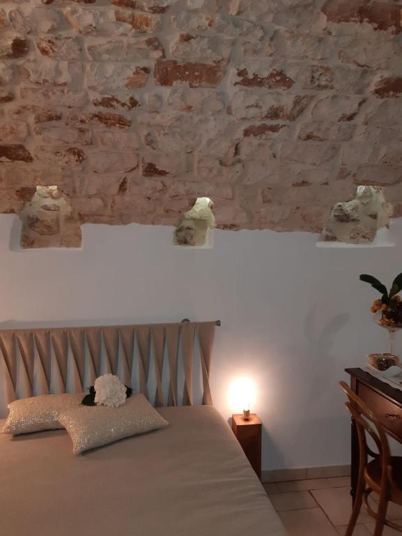 Postel nebo postele na pokoji v ubytování Donna Lucrezia dimora a corte B&B