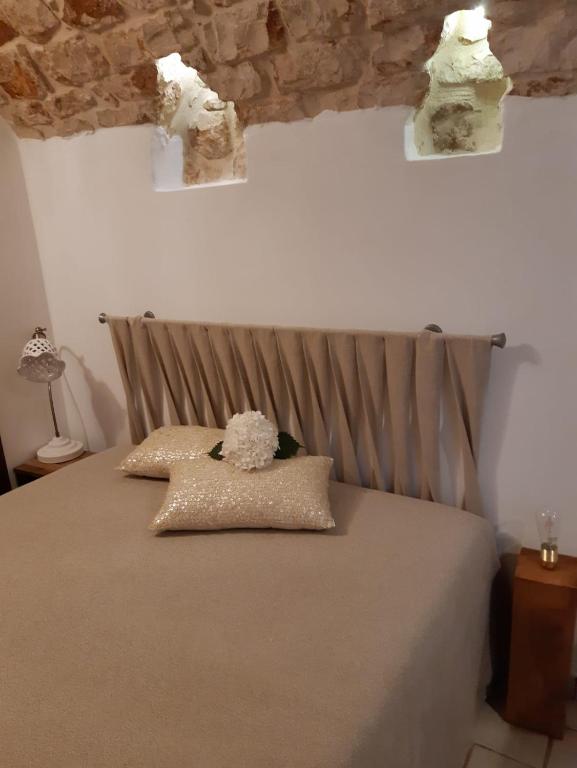 Postel nebo postele na pokoji v ubytování Donna Lucrezia dimora a corte B&B