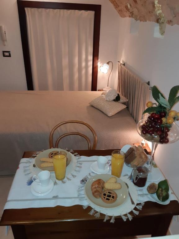 Postel nebo postele na pokoji v ubytování Donna Lucrezia dimora a corte B&B