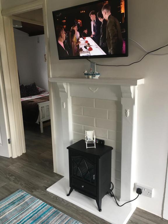 TV a/nebo společenská místnost v ubytování Chalet 26