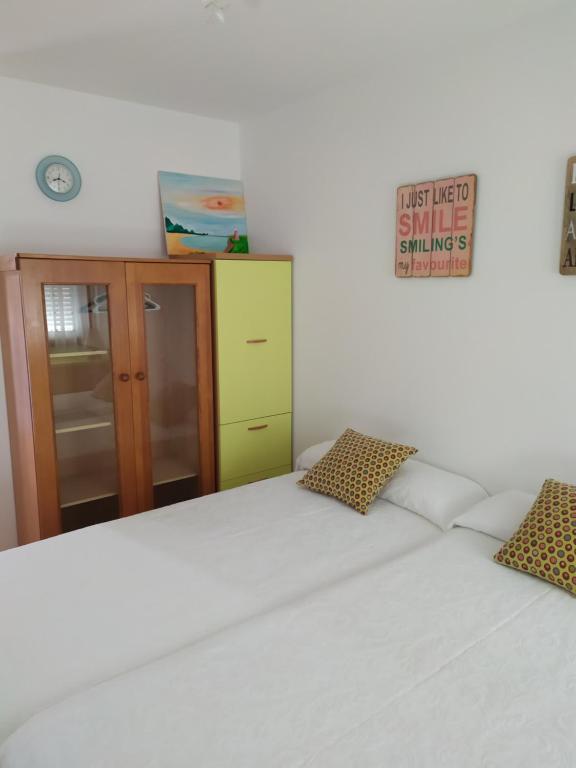 Postel nebo postele na pokoji v ubytování APARTAMENTO VILLA 3