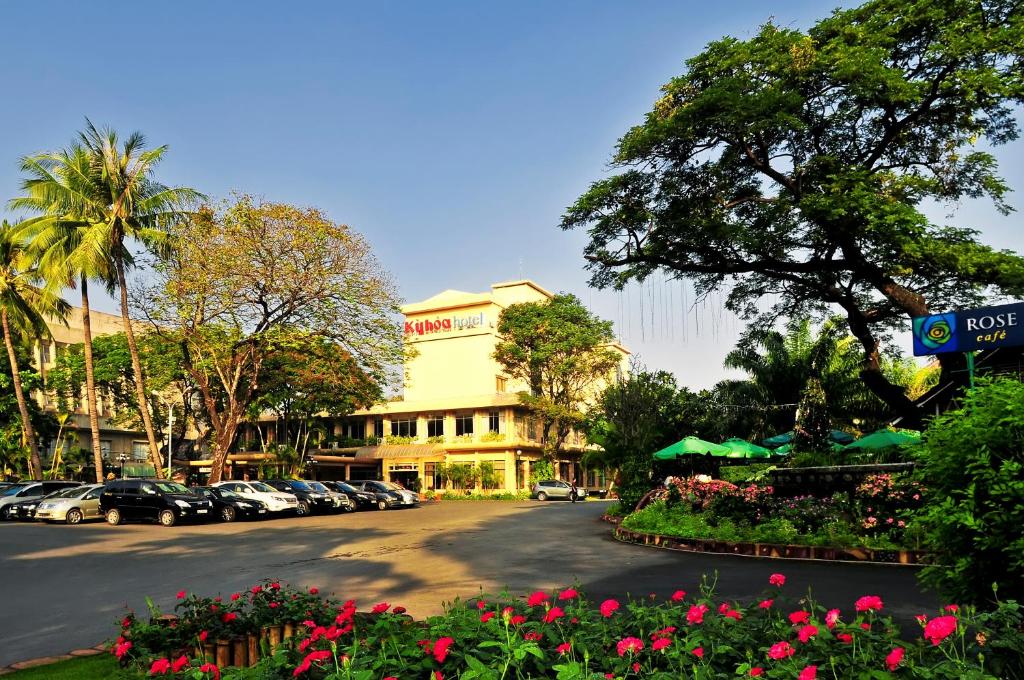 a street with cars parked on the side of a road at Ky Hoa Hotel Ho Chi Minh in Ho Chi Minh City