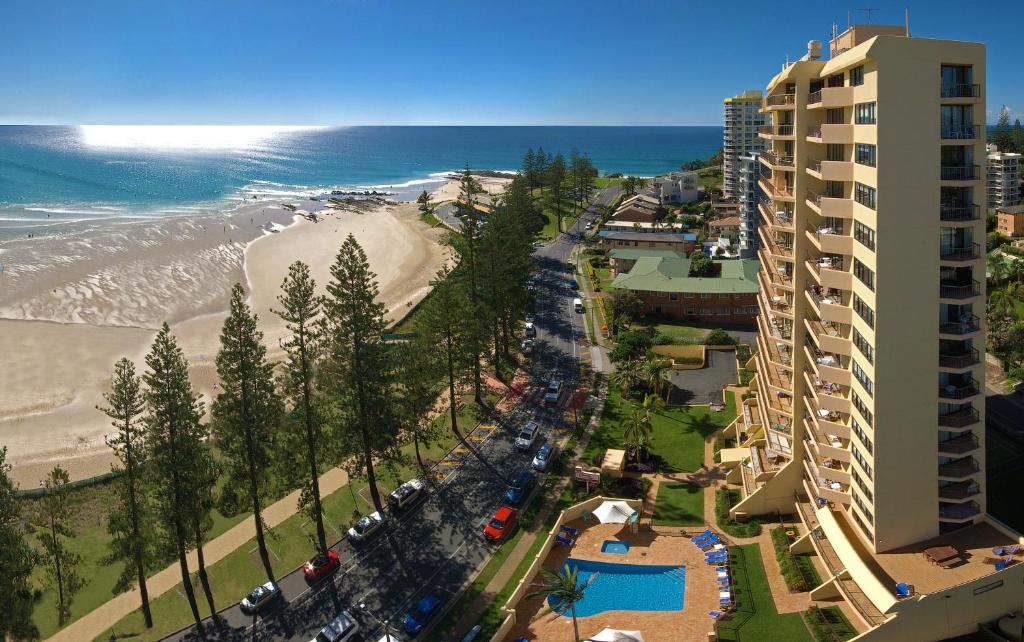 an aerial view of a beach and a building at Columbia Beachfront Apartments on Rainbow Bay in Gold Coast
