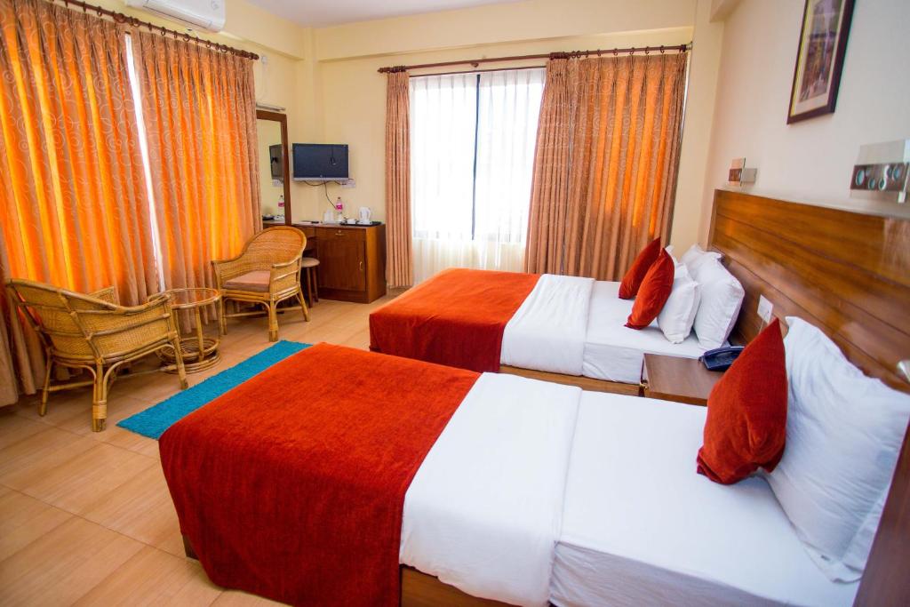 Ein Bett oder Betten in einem Zimmer der Unterkunft Hotel Tara