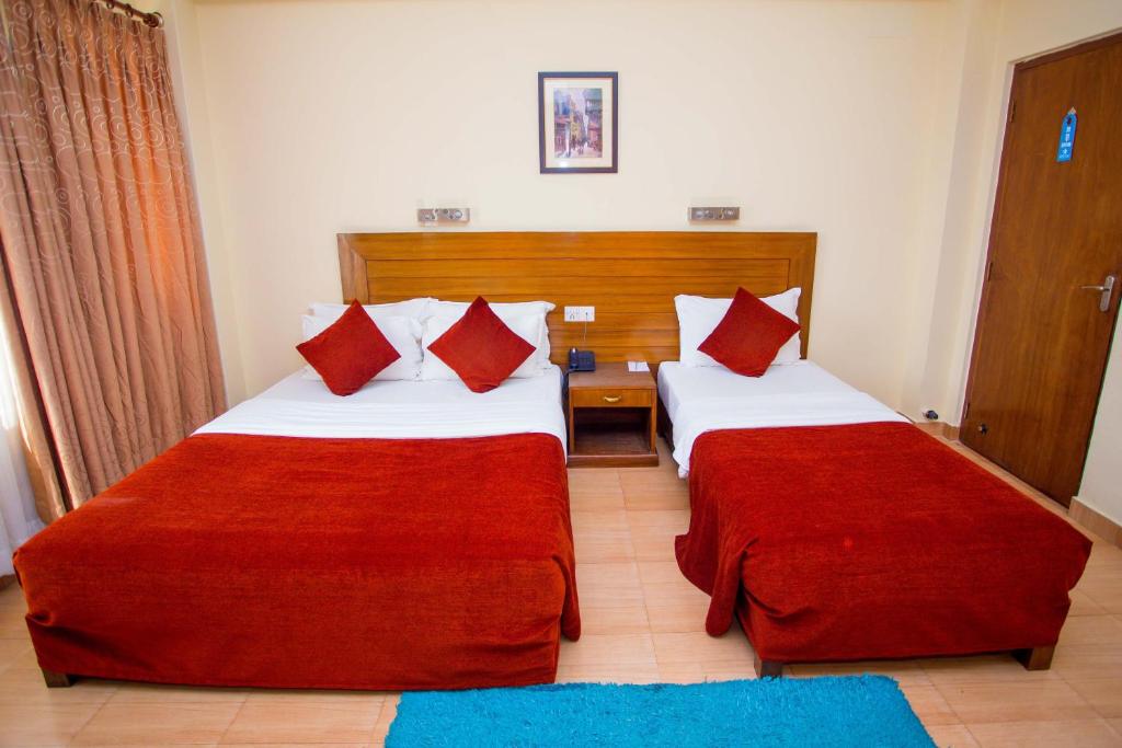 Ein Bett oder Betten in einem Zimmer der Unterkunft Hotel Tara