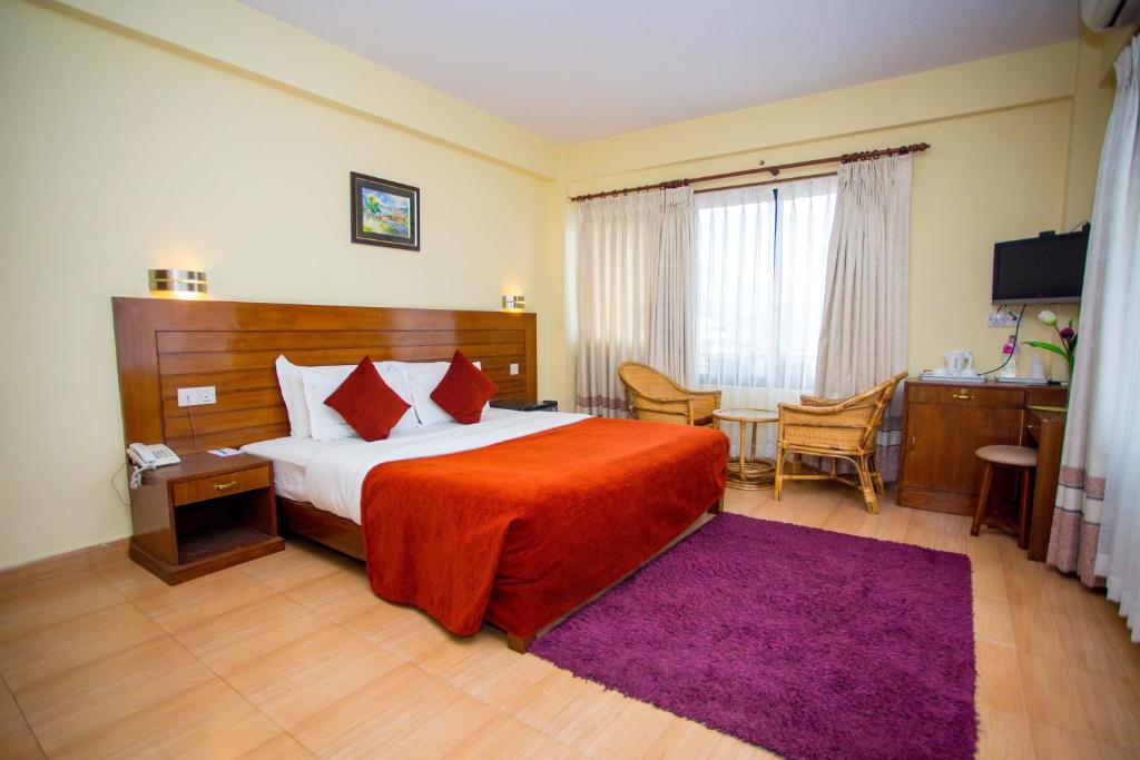 Ein Bett oder Betten in einem Zimmer der Unterkunft Hotel Tara