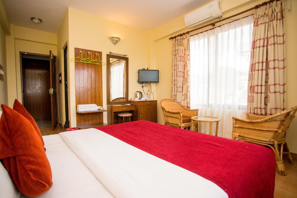 Ein Bett oder Betten in einem Zimmer der Unterkunft Hotel Tara