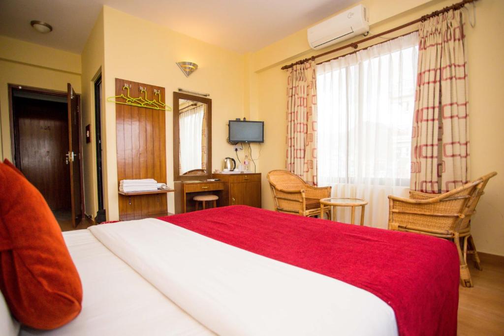 Ein Bett oder Betten in einem Zimmer der Unterkunft Hotel Tara