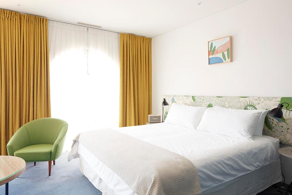 Postel nebo postele na pokoji v ubytování Hotel Ravesis