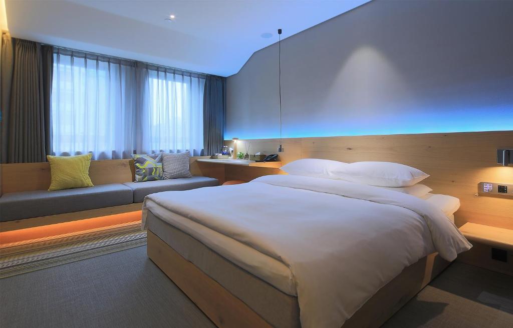 Voodi või voodid majutusasutuse EBO Hotel (Hangzhou West Lake) toas