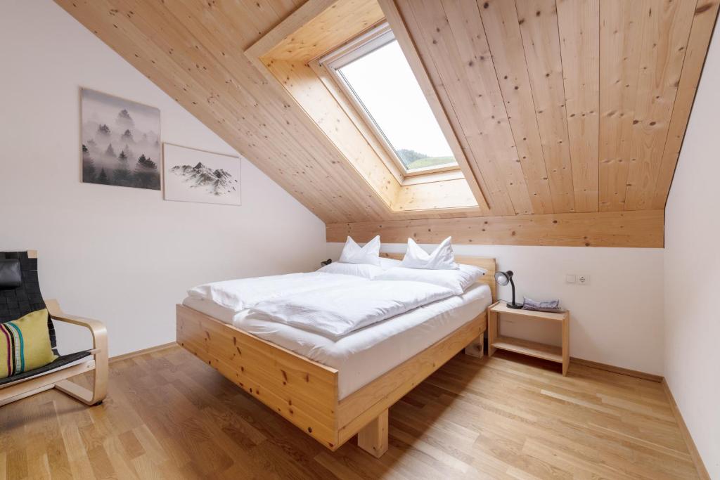 Postel nebo postele na pokoji v ubytování WÄLDERHAUS Apartments