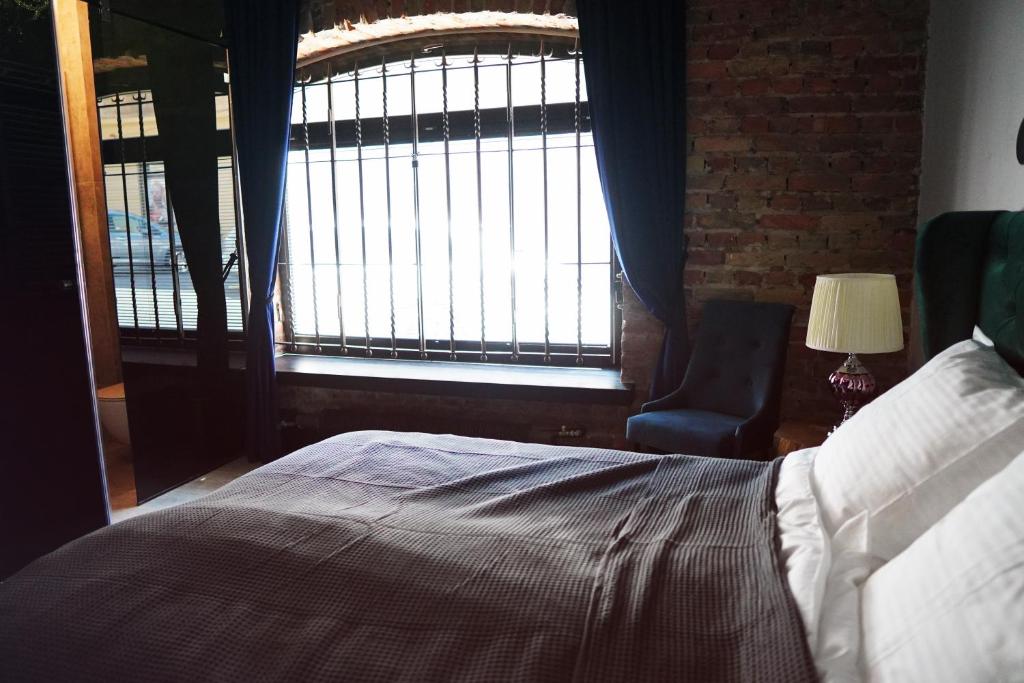 Posteľ alebo postele v izbe v ubytovaní Apartamenty Centrum RS SUITES Kowalska 12