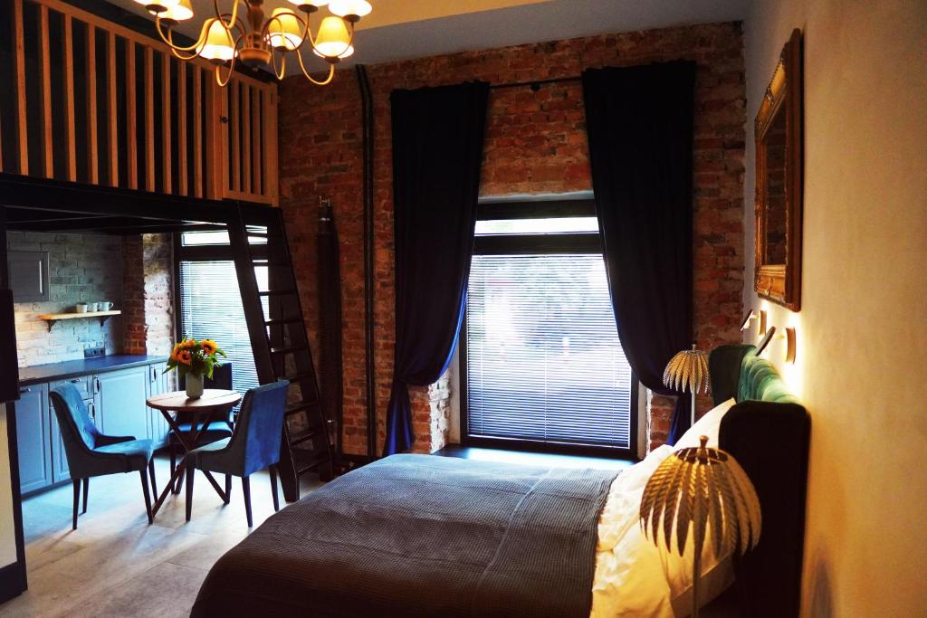 Posteľ alebo postele v izbe v ubytovaní Apartamenty Centrum RS SUITES Kowalska 12