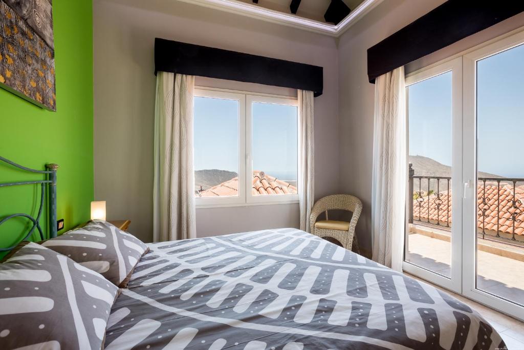 Postel nebo postele na pokoji v ubytování Villa Chayofa Sunrises