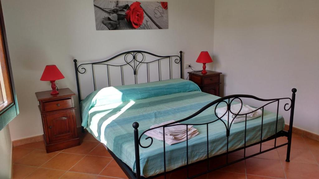 Letto o letti in una camera di Appartamenti I Mandorli