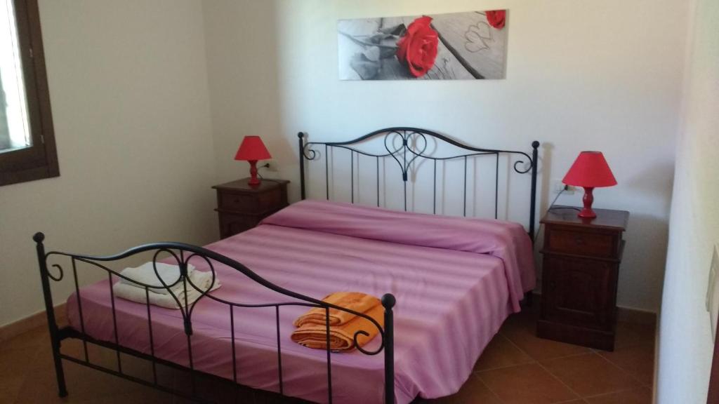 Letto o letti in una camera di Appartamenti I Mandorli