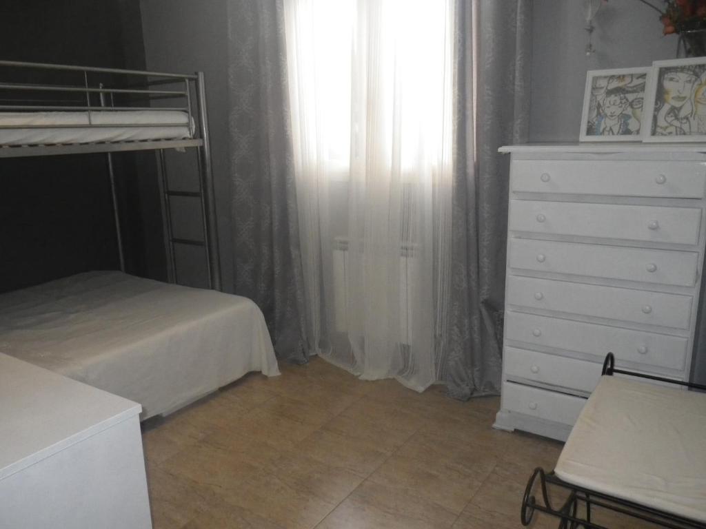 Posteľ alebo postele v izbe v ubytovaní Appt Terrasse, Piscine, Locamar Appt Cristina