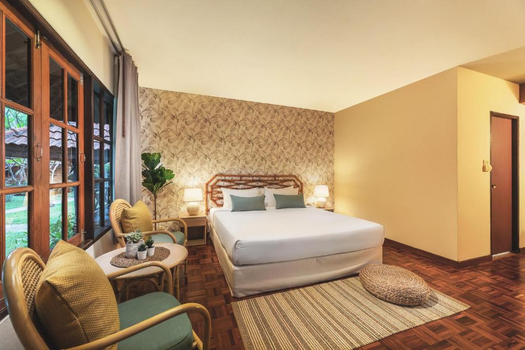 Rúm í herbergi á Regent - Chalet, Hua Hin