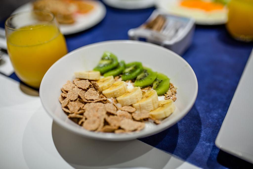 a white bowl of food on a table at IG Nachosol Atlantic & Yaizasol by Servatur - Adults Only in Puerto Rico de Gran Canaria