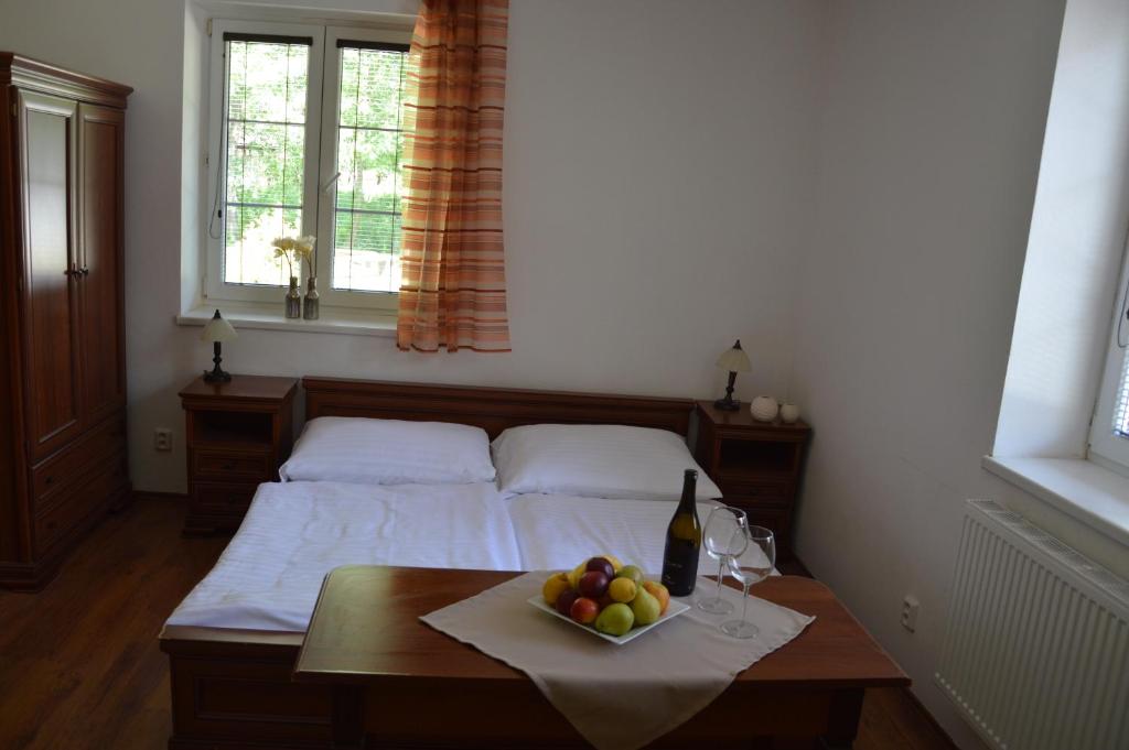 Postel nebo postele na pokoji v ubytování Apartmány Divoký Anděl