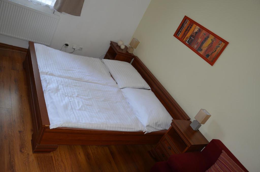Postel nebo postele na pokoji v ubytování Apartmány Divoký Anděl